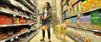 woman shopping with service dog